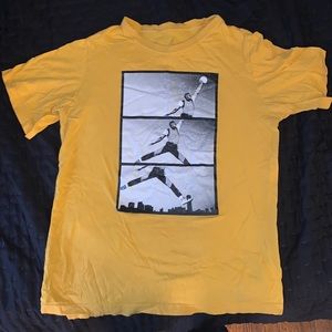 Yellow Jordan t shirt will fit an xs in men’s or xl in kids